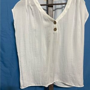 Chic White V-Neck Blouse with Button Accents small spot on front